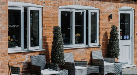 Halam Salon exterior with stylish seating in Newark, England, GB.