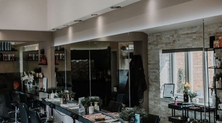 Modern interior of Halam Salon, elegant mirrors and chairs in Newark, England, GB.
