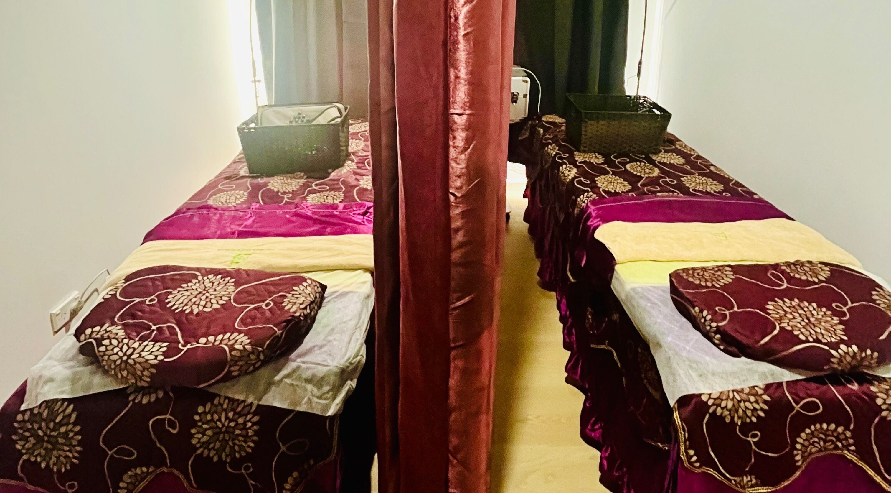 Luxury massage beds at RTC Wendouree Branch, Wendouree, Victoria, AU, with elegant floral satin covers.