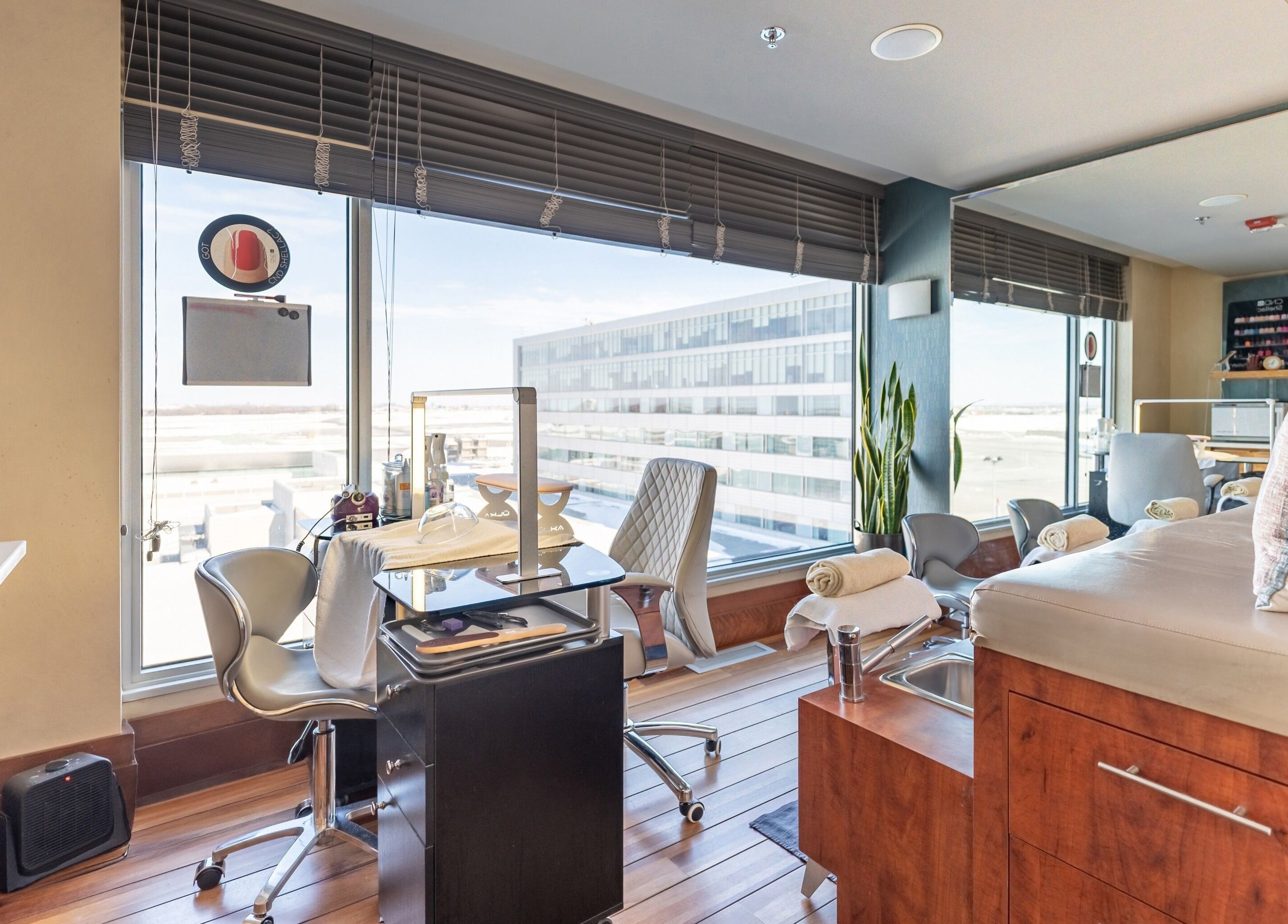 Comfortable spa room at Altispa - Montreal Airport - Marriott, Dorval, Québec, CA, with relaxing chairs and view.