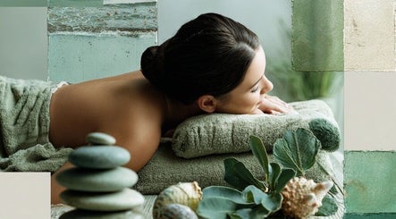 Relaxing massage at Natalie's Mobile Massage in Yarrabilba, Queensland, AU with green towels and stones.