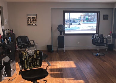 Interior of Elite Cuts Barber Salon in Chippewa Falls, Wisconsin, showcasing stylish chairs and equipment.