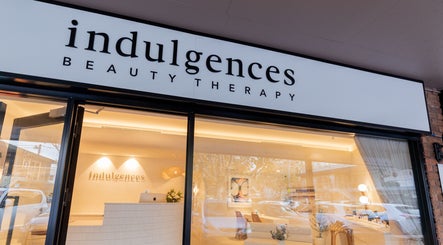 Front view of Indulgences beauty therapy at The Junction, New South Wales, AU, showcasing elegant signage.