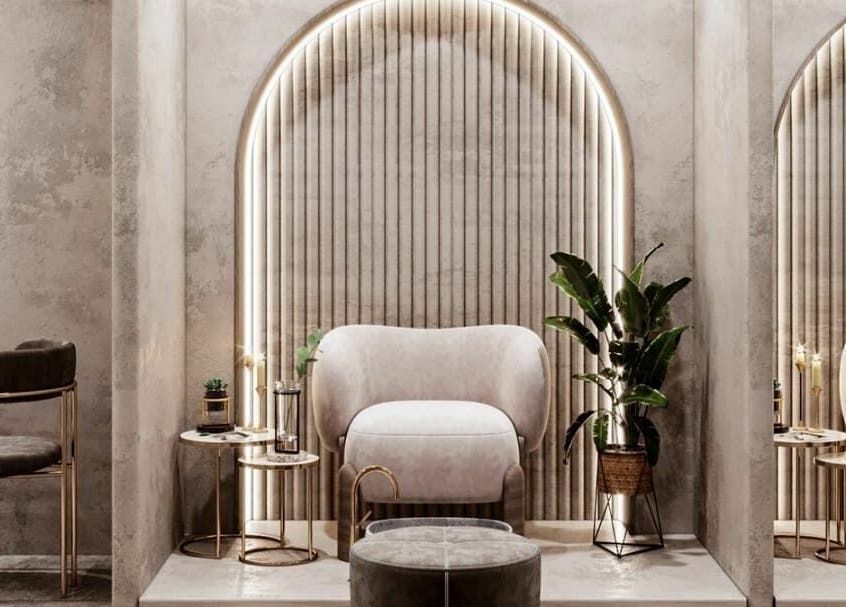 Elegant seating area in Royal Nordic Beauty Salon, Dubai, AE, showcasing plush chairs and ambient lighting.