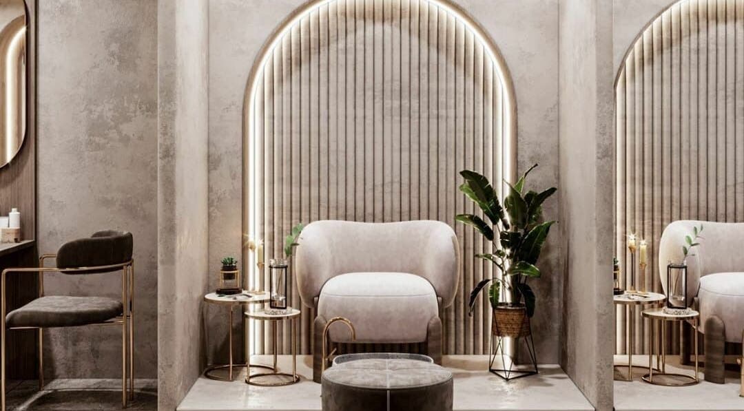 Elegant seating area in Royal Nordic Beauty Salon, Dubai, AE, showcasing plush chairs and ambient lighting.