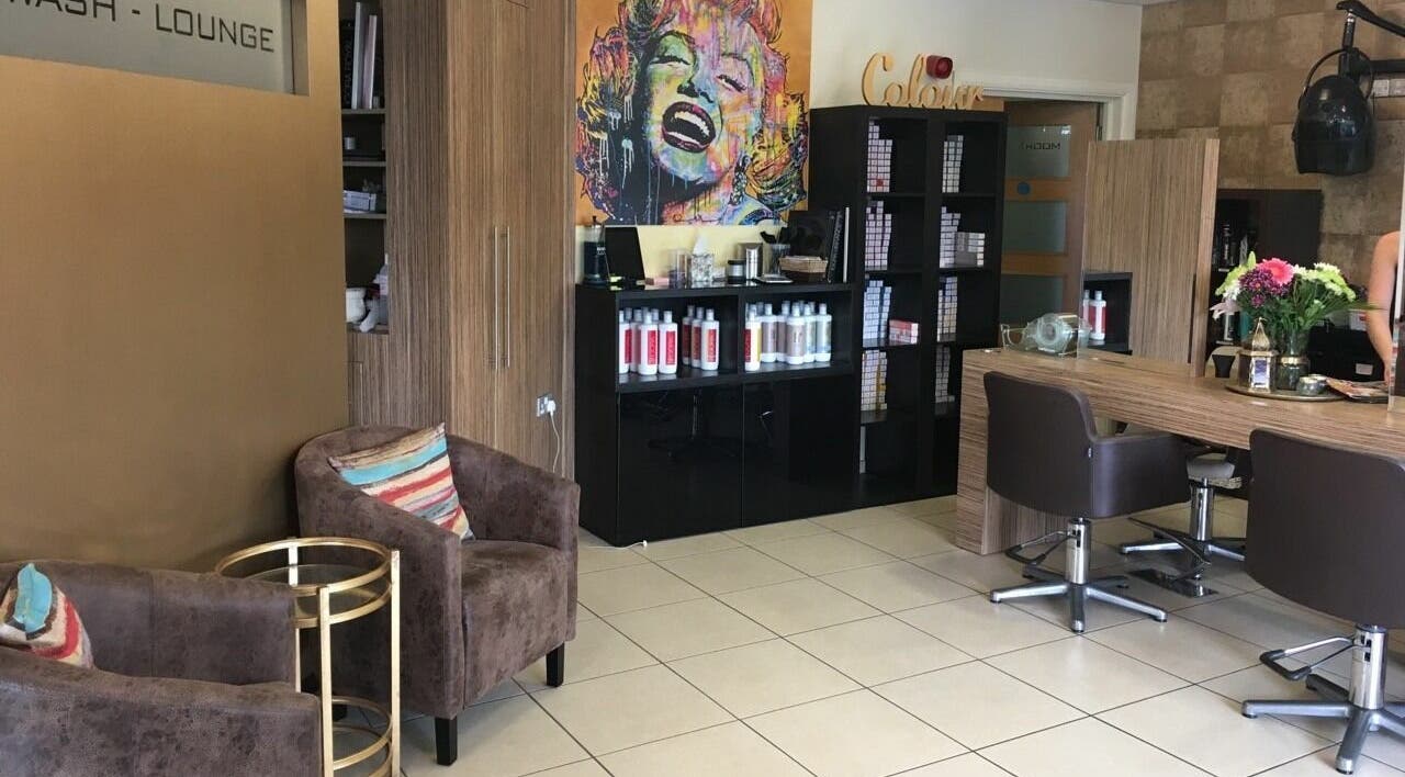 Modern interior of Principles Hair Design Ltd in Flitwick, England, GB with stylish decor and hair products.
