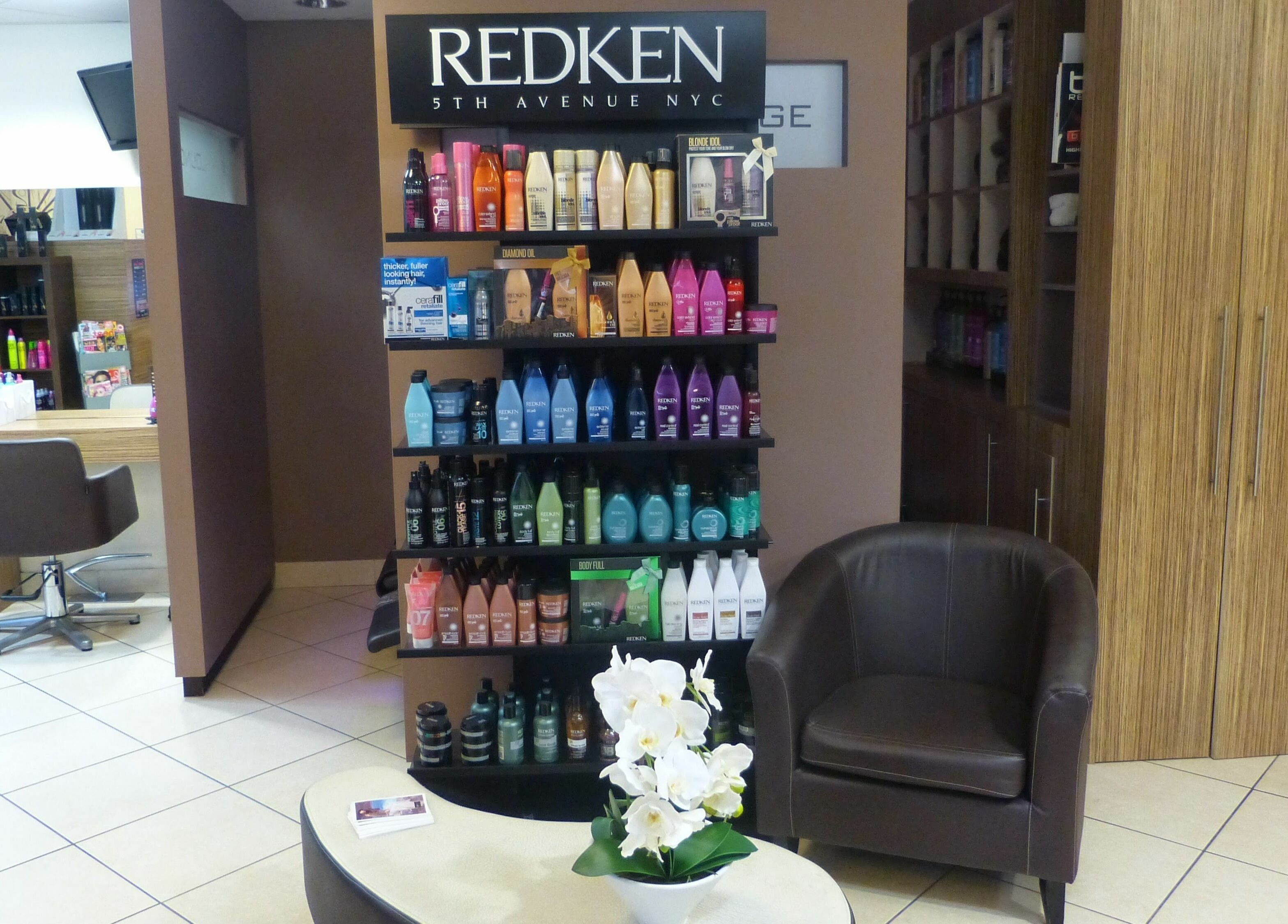 Stylish hair product display at Principles Hair Design Ltd, Flitwick, England, GB with Redken products.