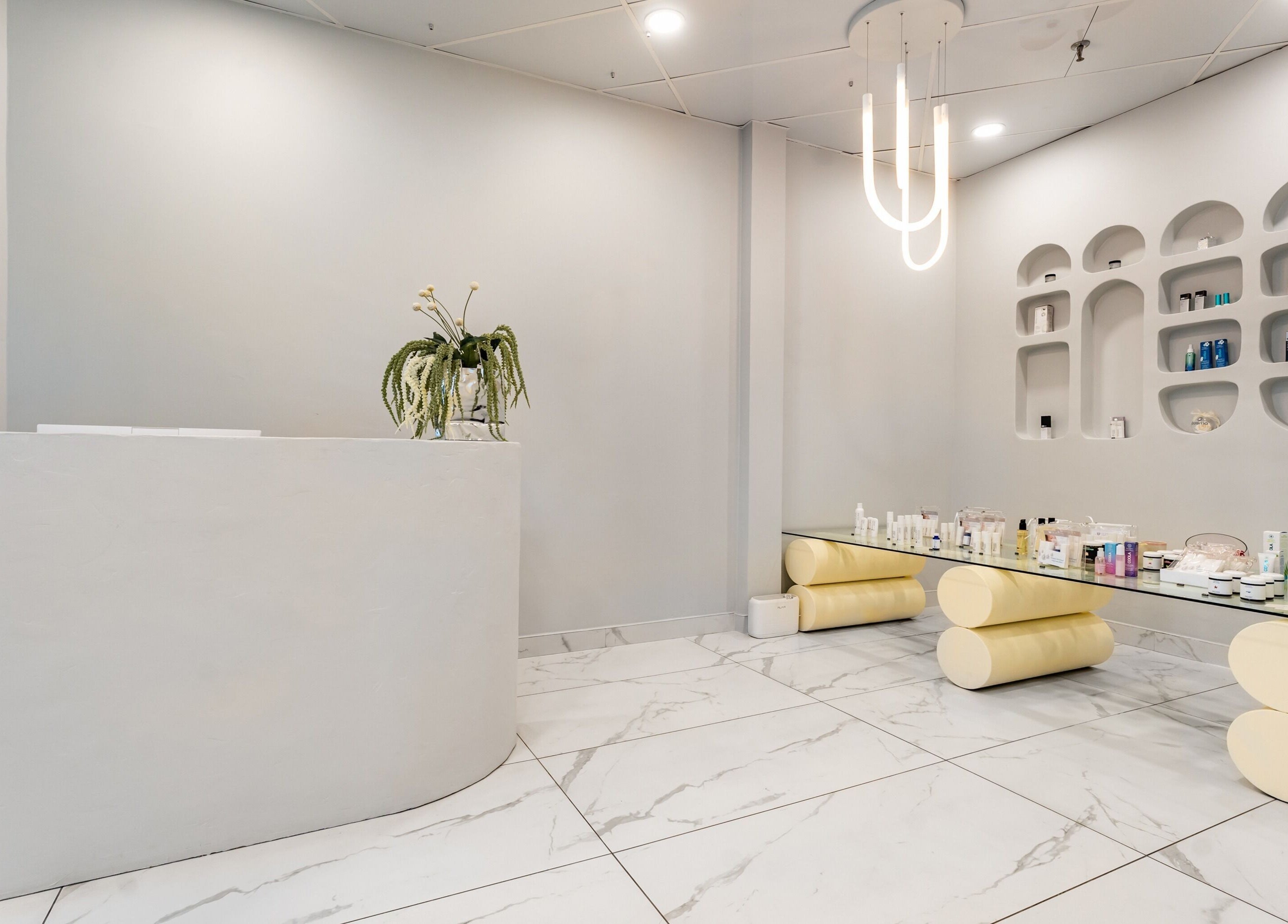 Cosmo's elegant reception area with products on display, located in Montréal, Québec, CA.