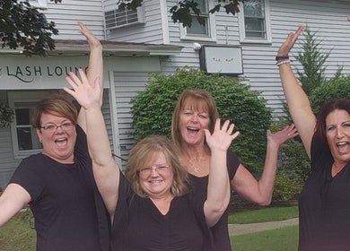 Gents Barber Shop staff celebrating in front of the shop, located in Hampton, New Hampshire, US.