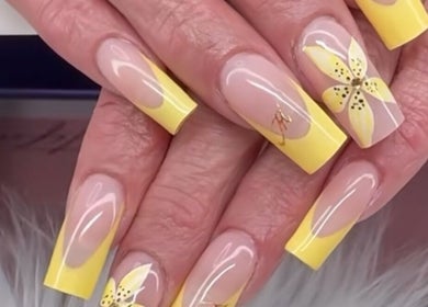 Yellow floral nail art at Eye Candy Esthetics By Shanai in Oshawa, Ontario, CA.