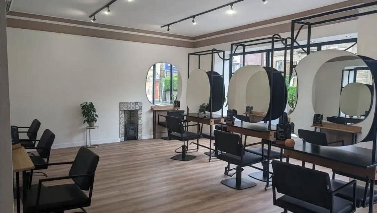 Modern salon seating and mirrors at The Arch Studio, West Calder, Scotland, GB.