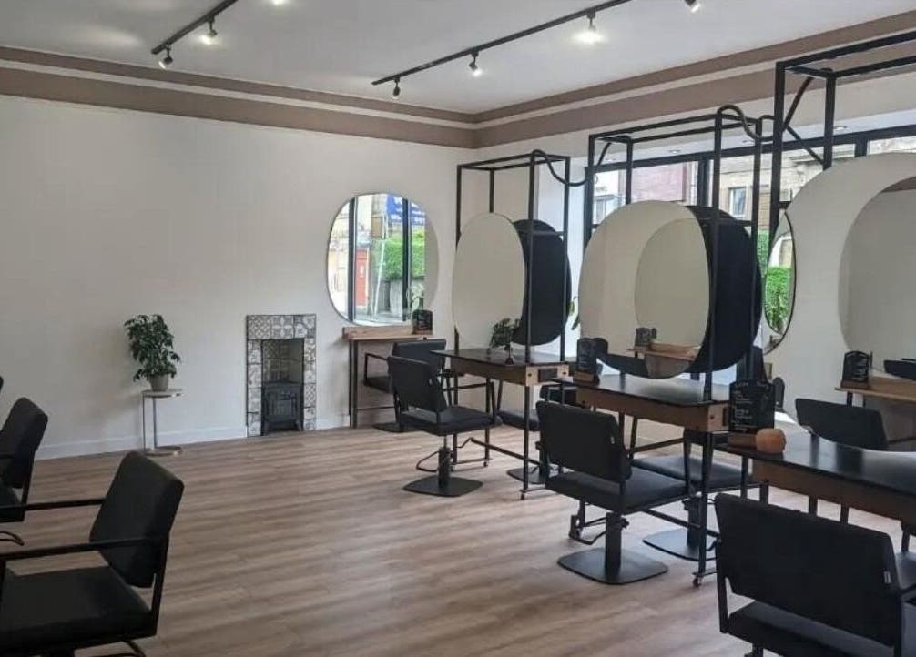 Modern salon seating and mirrors at The Arch Studio, West Calder, Scotland, GB.