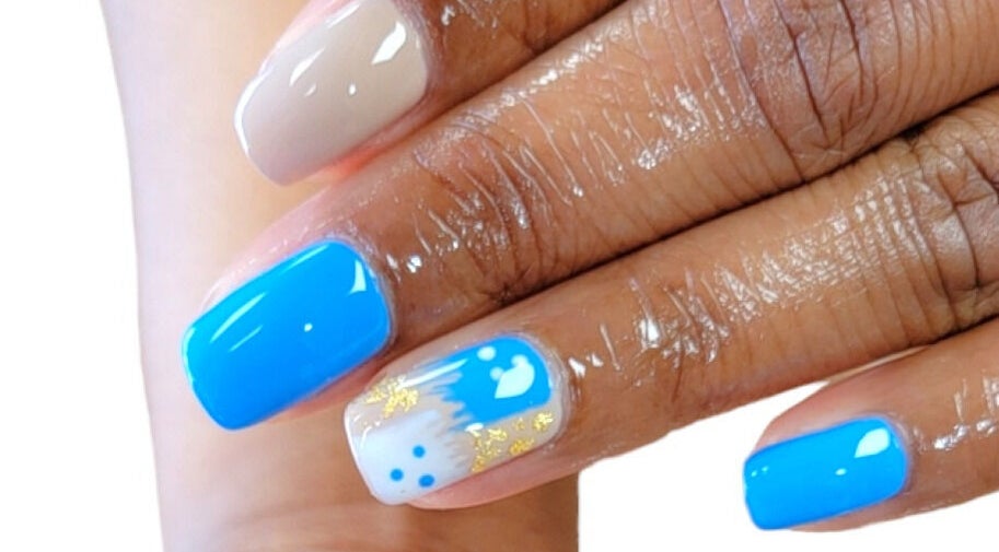 Vibrant blue and beige nail art at Everlasting Hair and Nails, Peoria, Illinois, US.