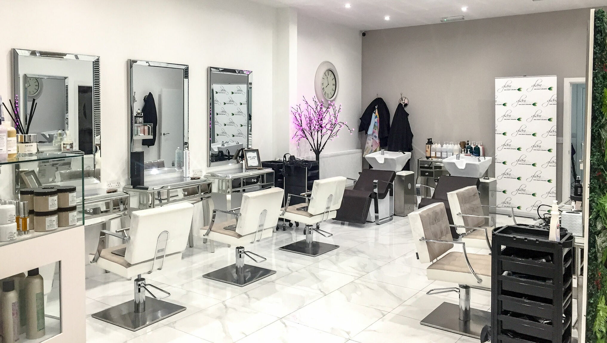Modern salon interior at Glam and Go, Bamber Bridge, England, GB with stylish chairs and decor.