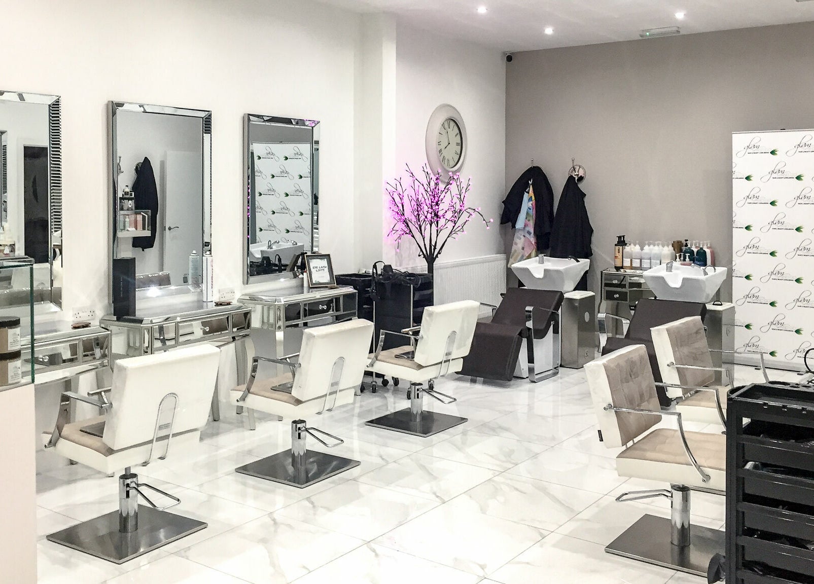 Modern salon interior at Glam and Go, Bamber Bridge, England, GB with stylish chairs and decor.