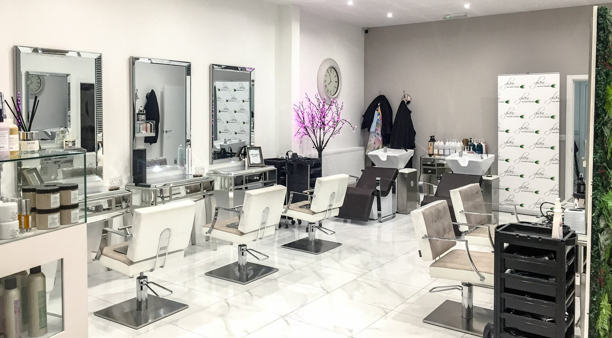 Modern salon interior at Glam and Go, Bamber Bridge, England, GB with stylish chairs and decor.