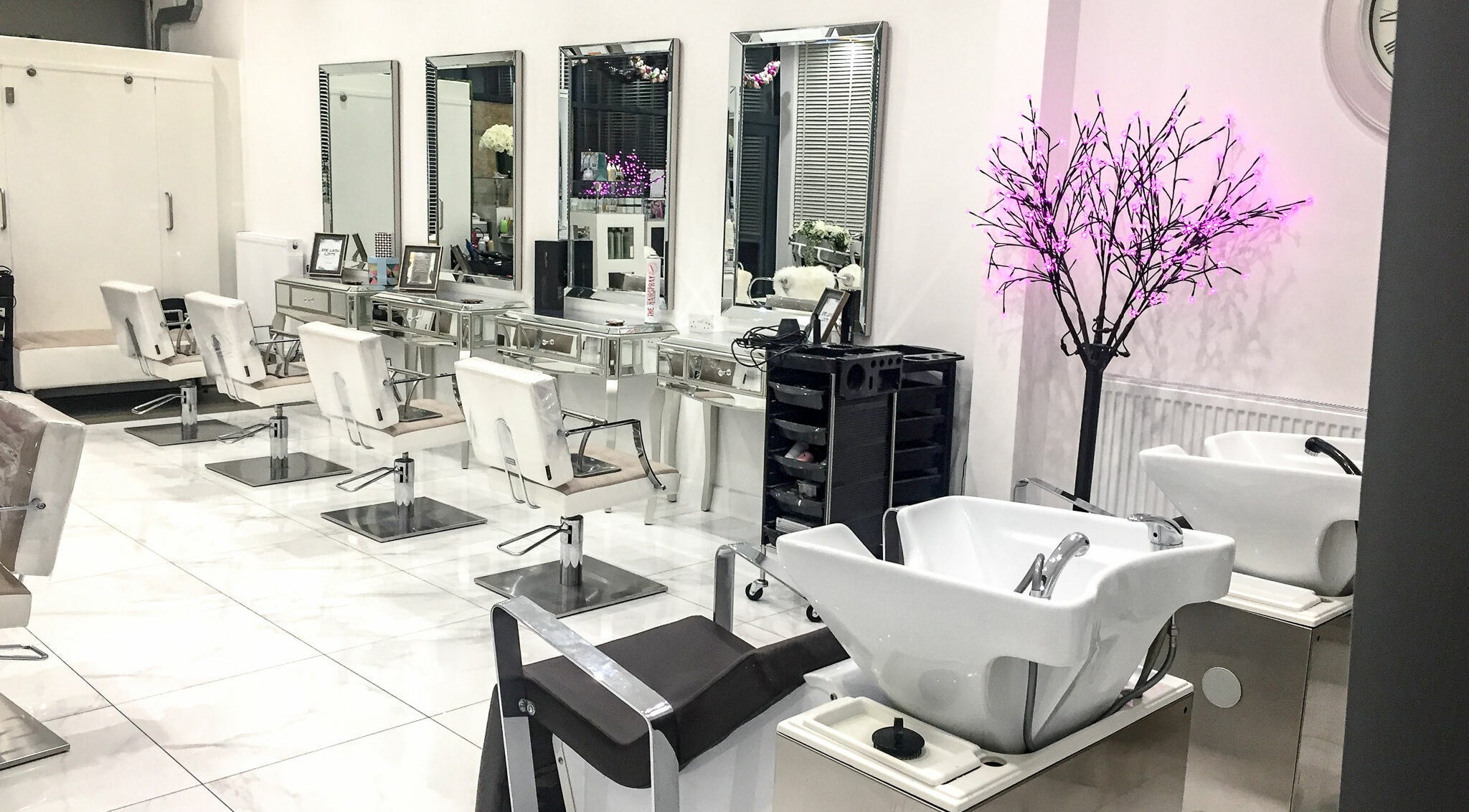 Modern salon chairs and mirrors at Glam and Go, Bamber Bridge, England, GB, enhance this chic beauty space.