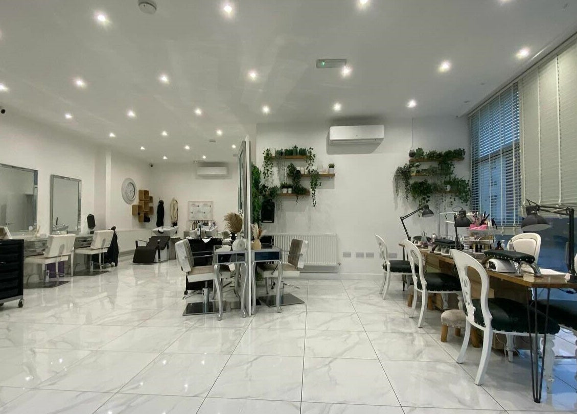 Chic interior of Glam and Go beauty salon in Bamber Bridge, England, GB featuring elegant decor and seating.