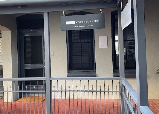 Front entrance of The Skin Genesis Collective, Nedlands, Western Australia, AU with modern signage and railing.