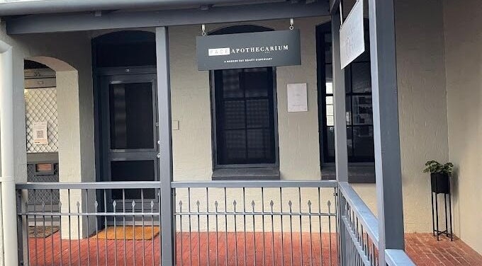 Front entrance of The Skin Genesis Collective, Nedlands, Western Australia, AU with modern signage and railing.