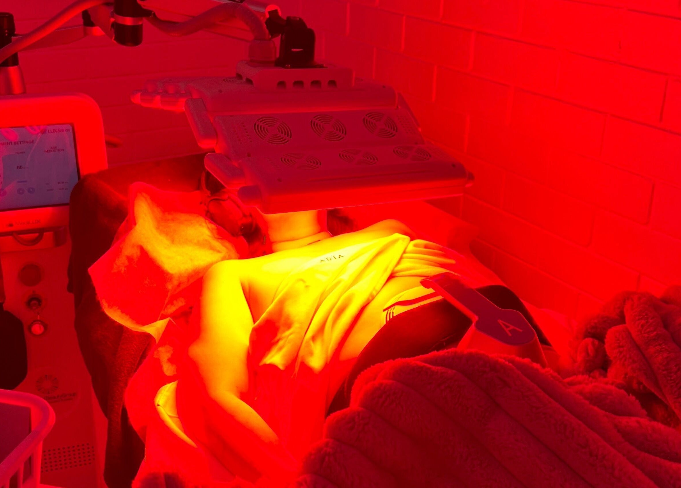 LED therapy session at The Skin Genesis Collective, Nedlands, WA, AU, featuring advanced facial technology.