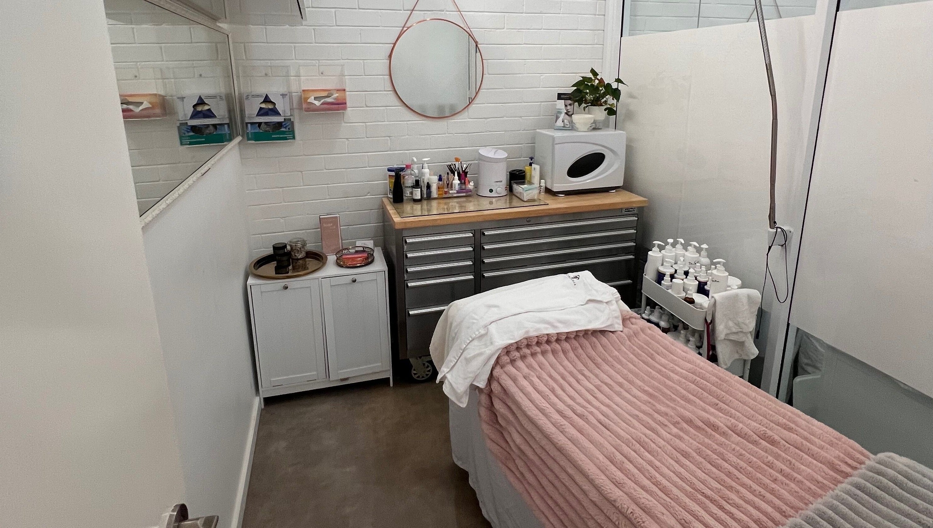 Cozy treatment room at The Skin Genesis Collective, Nedlands, Western Australia, AU. Inviting space for wellness.