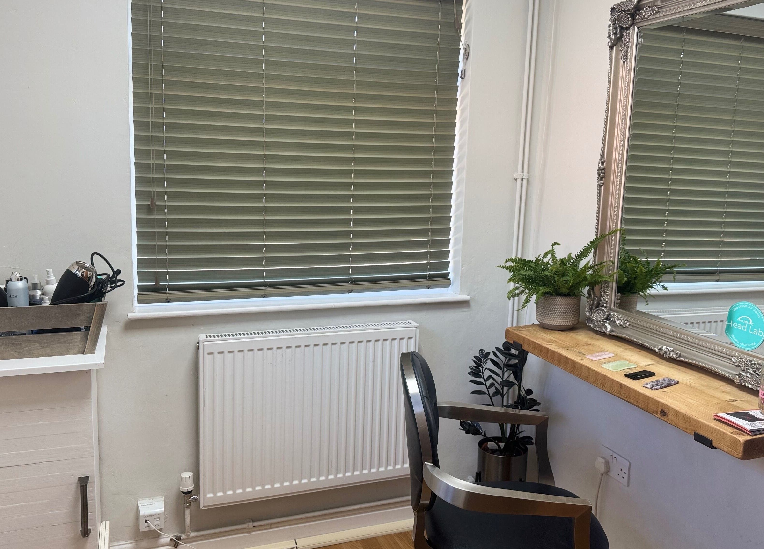 Cozy styling station at Gemma B Holistic Hairdressing in Dunstable, England, GB with elegant decor.