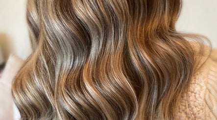 Long, wavy blonde hair styled at Gemma B Holistic Hairdressing in Dunstable, England, GB.
