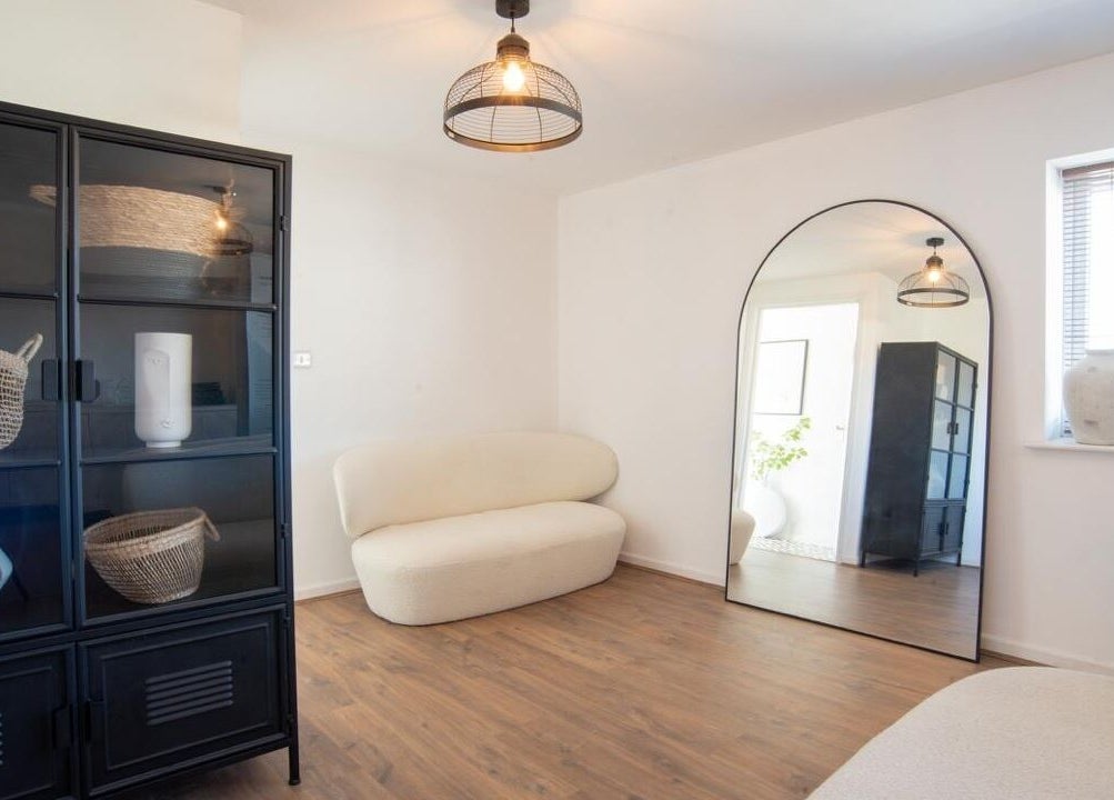 Chic, minimalist lounge at Erase That Ink, Newton Abbot, England, GB with cozy seating and stylish decor.