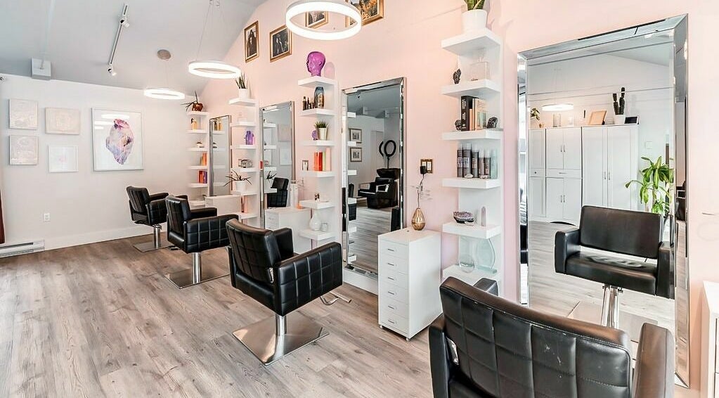 Modern salon interior at Bella Luxe Studio in Bedford, Nova Scotia, CA, featuring stylish seating and elegant decor.