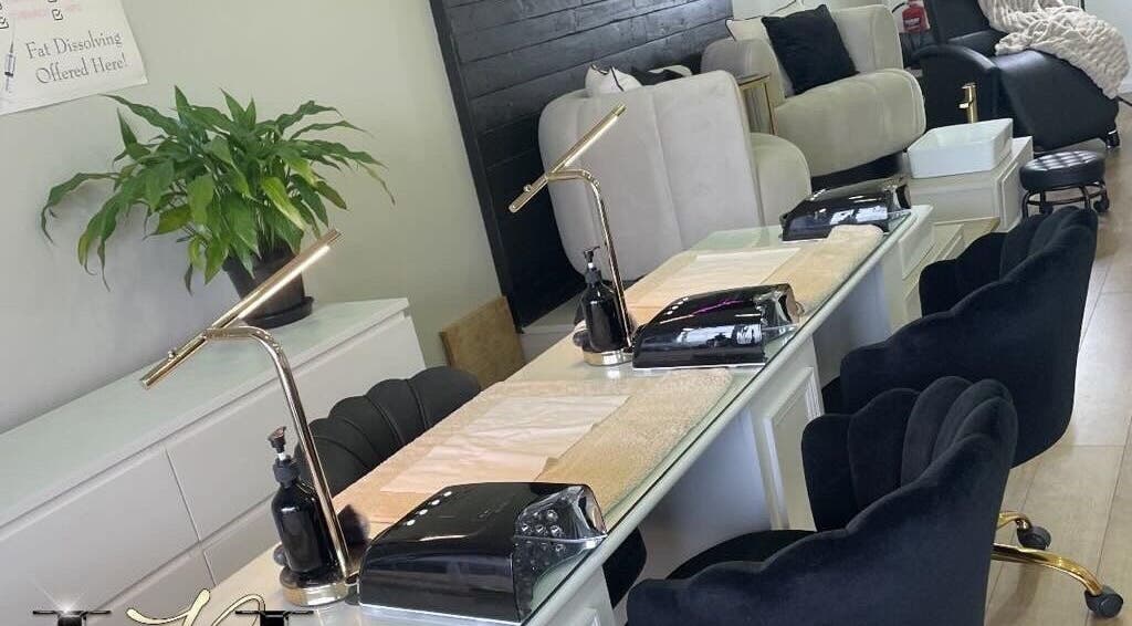 Luxor Beauty Lounge's chic nail station in Lancing, England, GB with sleek chairs and modern decor.