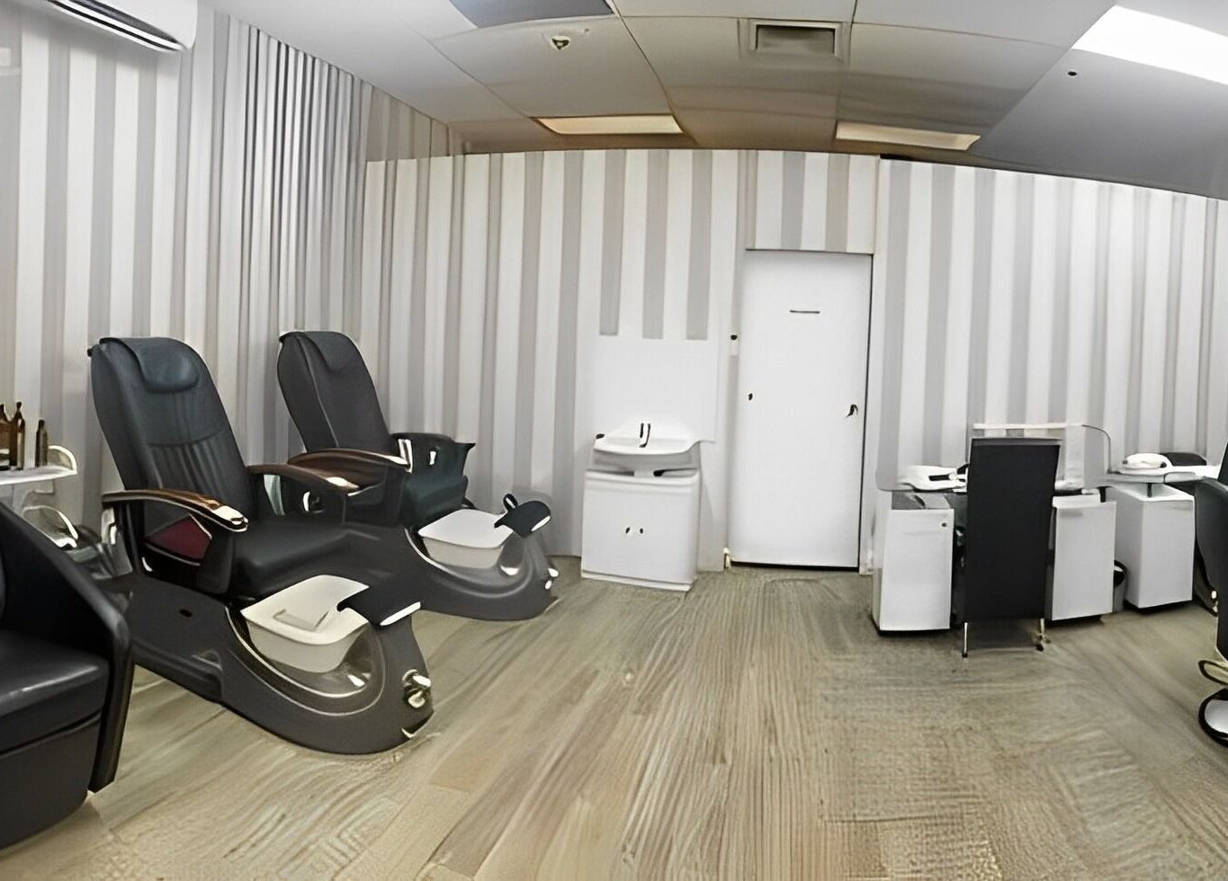 Spacious interior of Pari's Hair and Beauty Salon in Hamilton, Waikato, NZ, featuring plush seating and modern design.