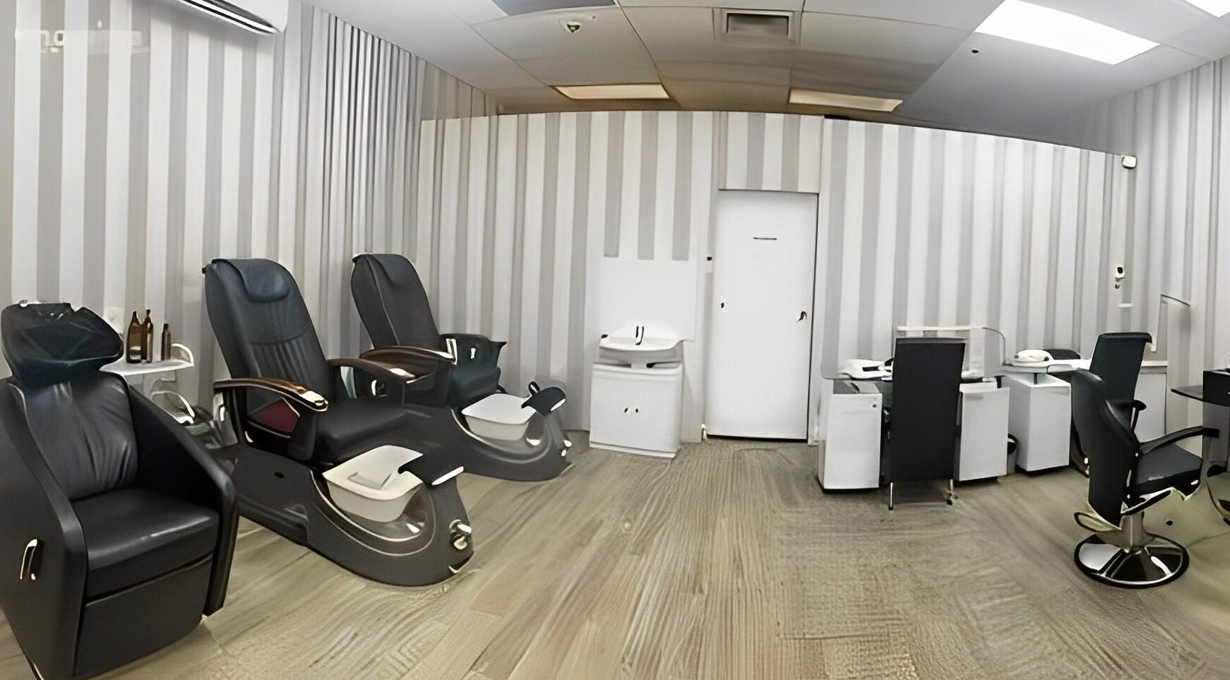 Spacious interior of Pari's Hair and Beauty Salon in Hamilton, Waikato, NZ, featuring plush seating and modern design.