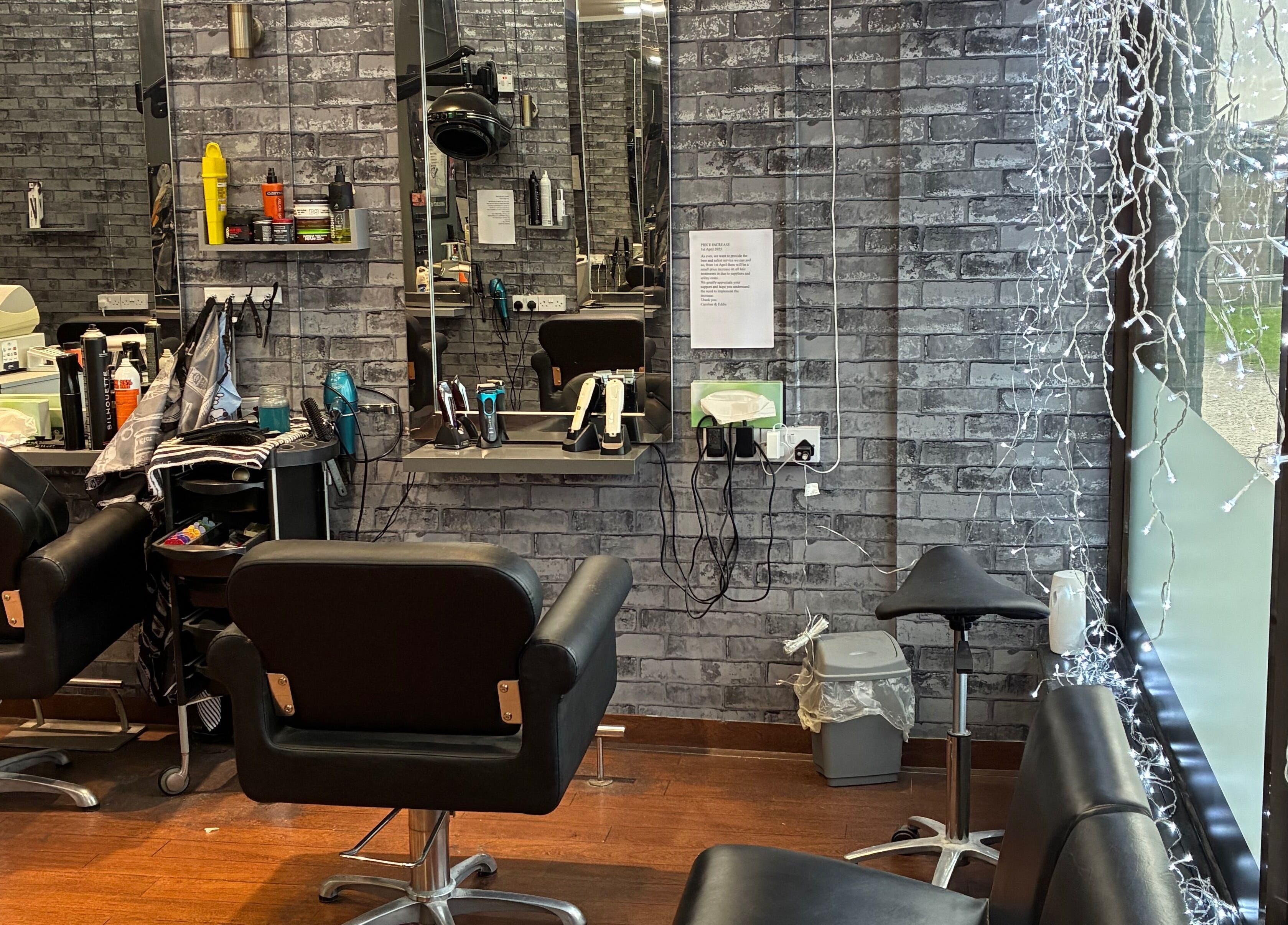 Interior of Edwins Hair and Skincare Centre, Belfast, Northern Ireland, showing modern salon chairs and mirrors.