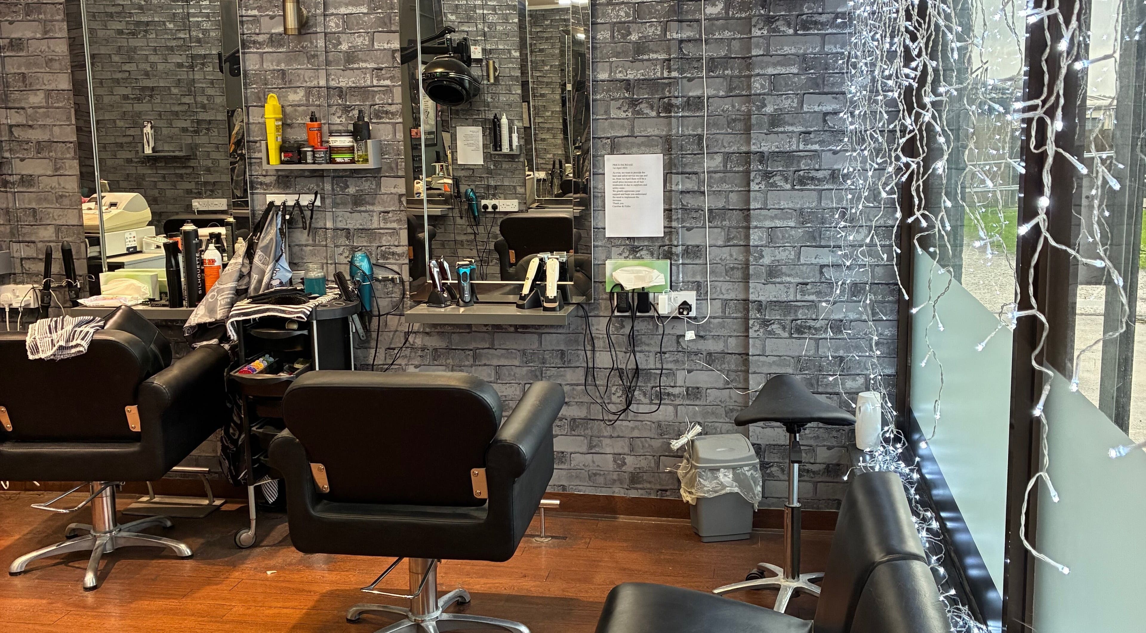 Interior of Edwins Hair and Skincare Centre, Belfast, Northern Ireland, showing modern salon chairs and mirrors.