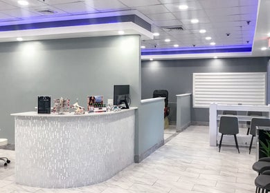 Interior of Epic Nail Bar, Orleans, Massachusetts, US, featuring elegant seating and sleek design.