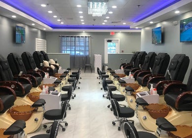 Pedicure chairs at Epic Nail Bar, Orleans, Massachusetts, US showcasing a chic and modern interior.