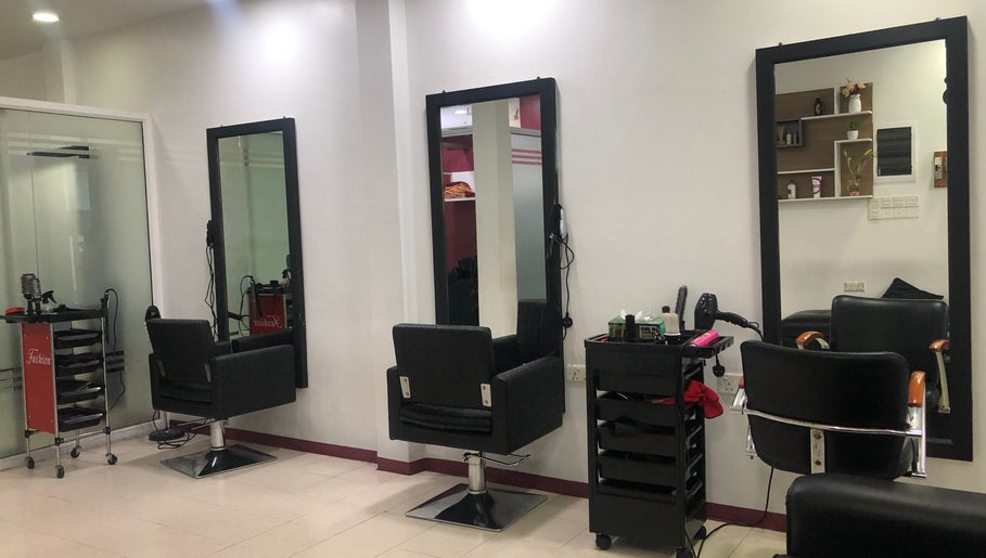 Elegant salon setup at Gloss Salon in Malé, Male, MV, featuring modern chairs and styling stations.