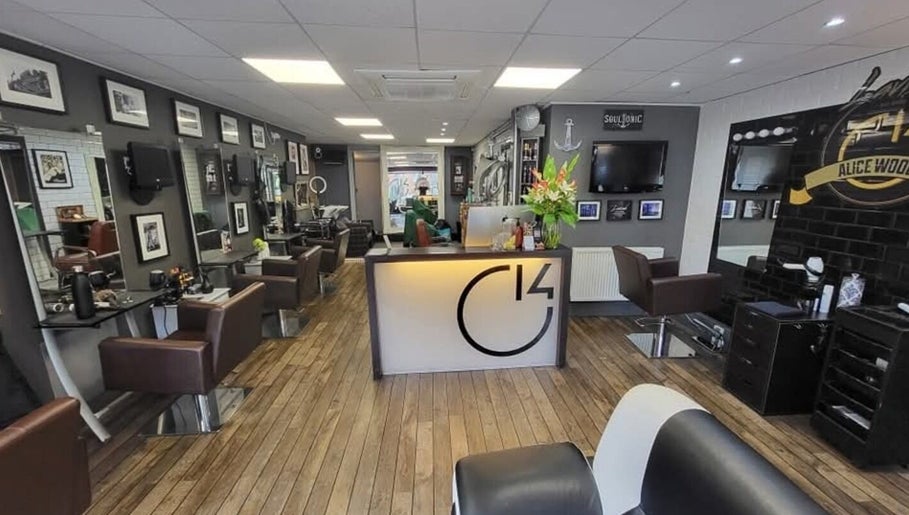 Modern beauty salon interior at Alice Woolf, Gloucester, England, GB, showcasing stylish decor and seating.