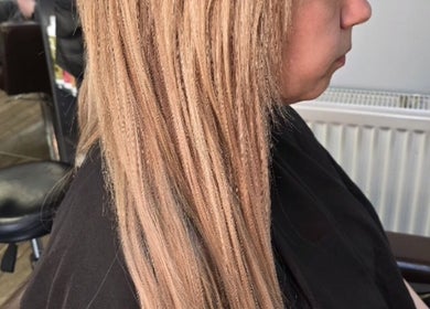 Elegant blonde hair styling at Alice Woolf, Gloucester, England, GB. Experience premium hair care.