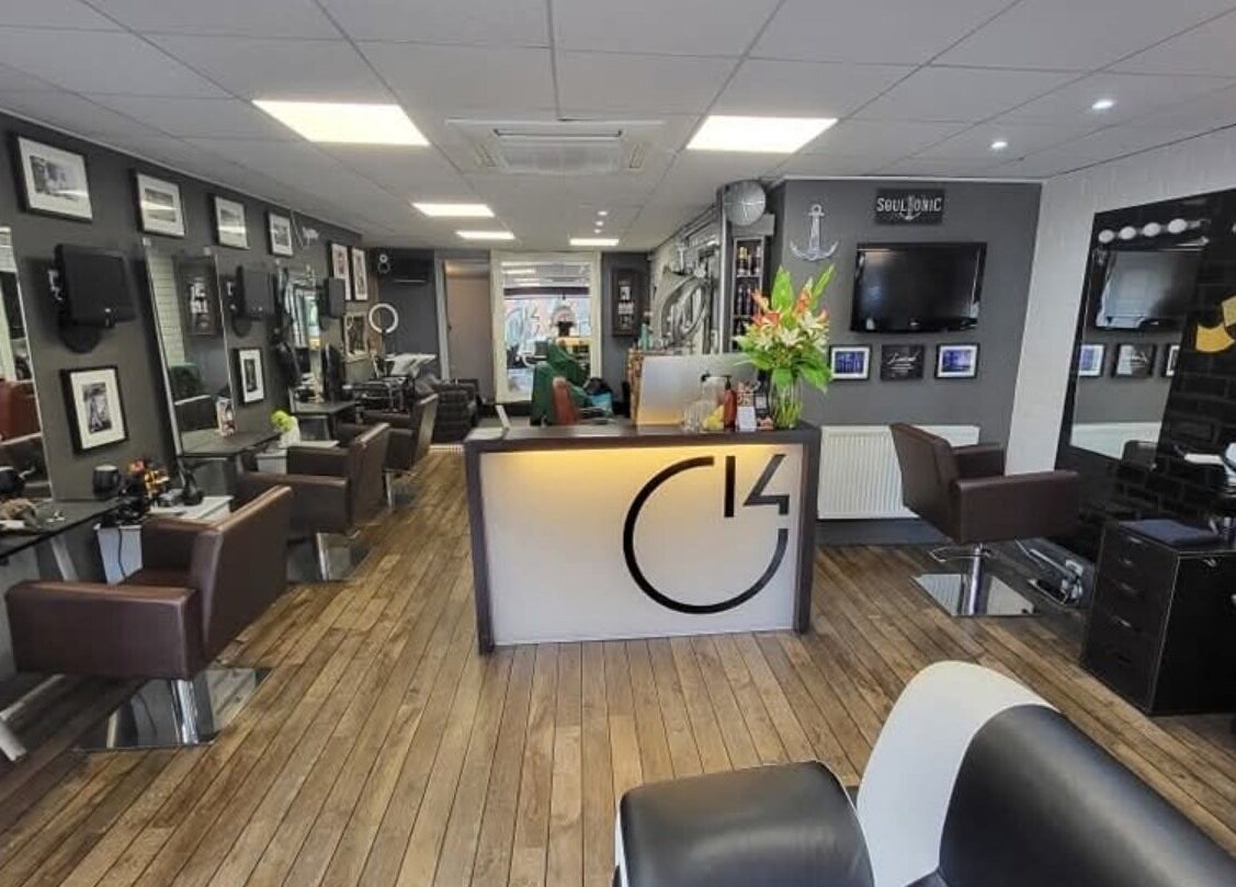 Modern salon interior at Alice Woolf in Gloucester, England, GB with stylish decor and welcoming ambiance.