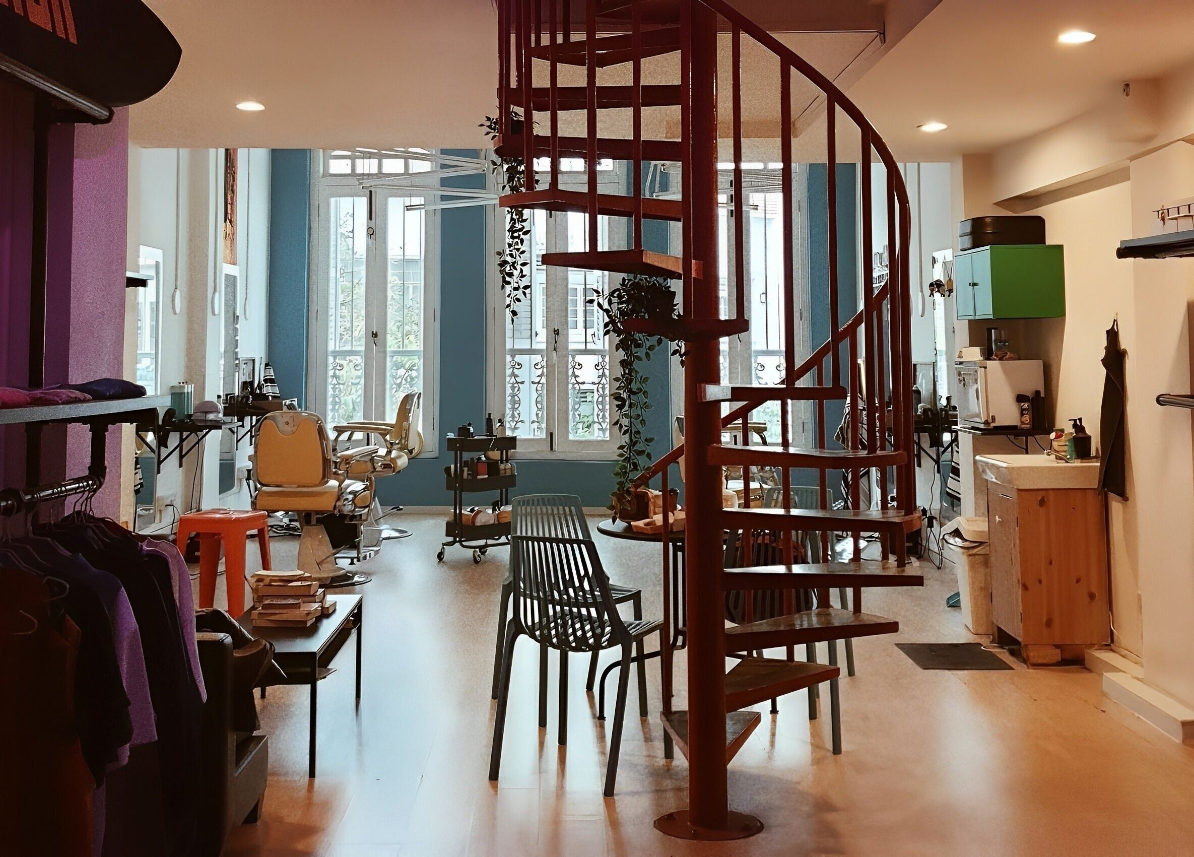 Stylish interior of Bodeiga in Singapore with spiral staircase and sleek decor.