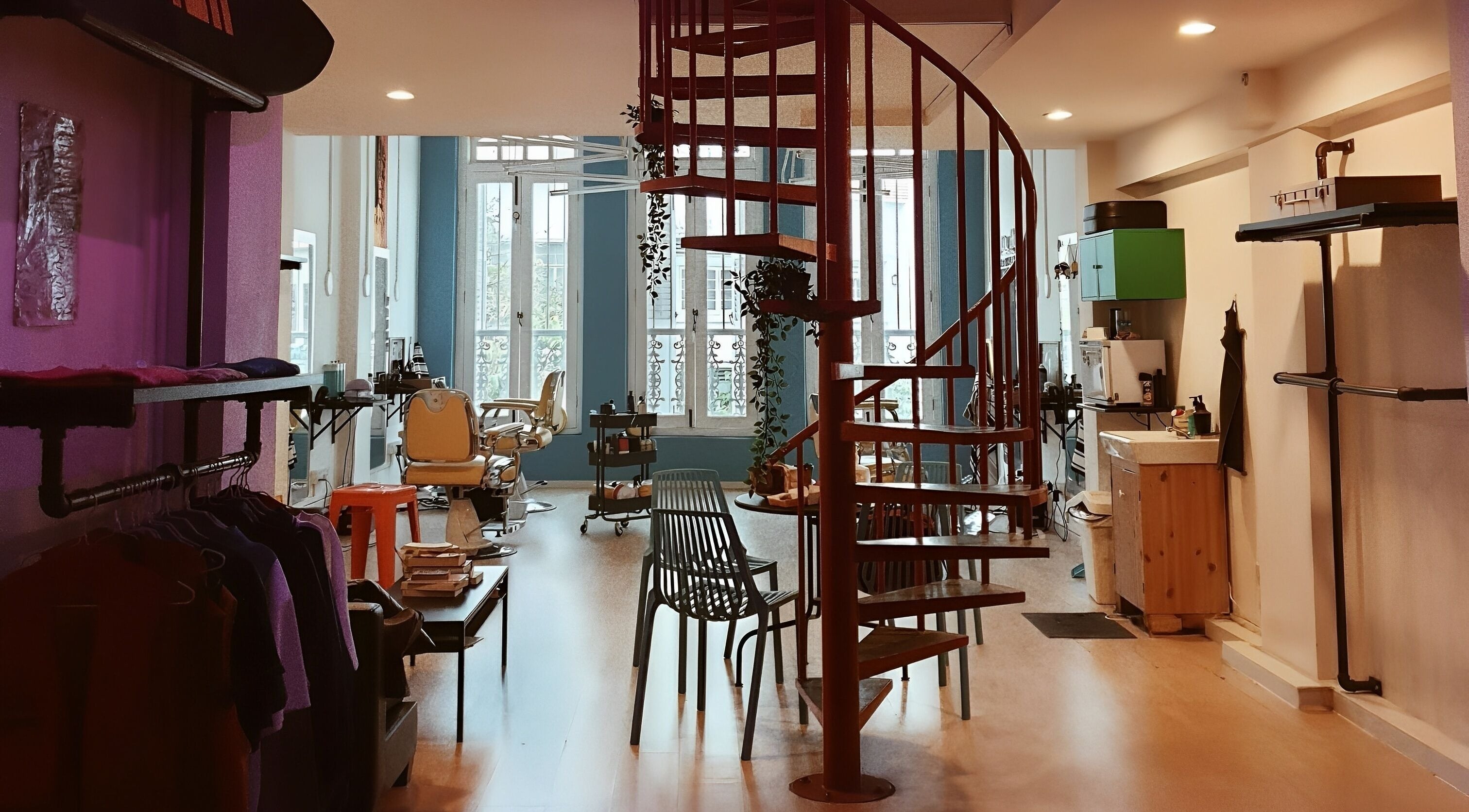 Stylish interior of Bodeiga in Singapore with spiral staircase and sleek decor.