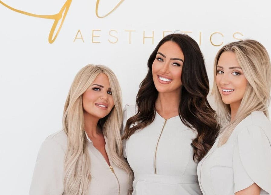 Team smiling at Kylie Aesthetics, Christchurch, GB offering premium beauty services.