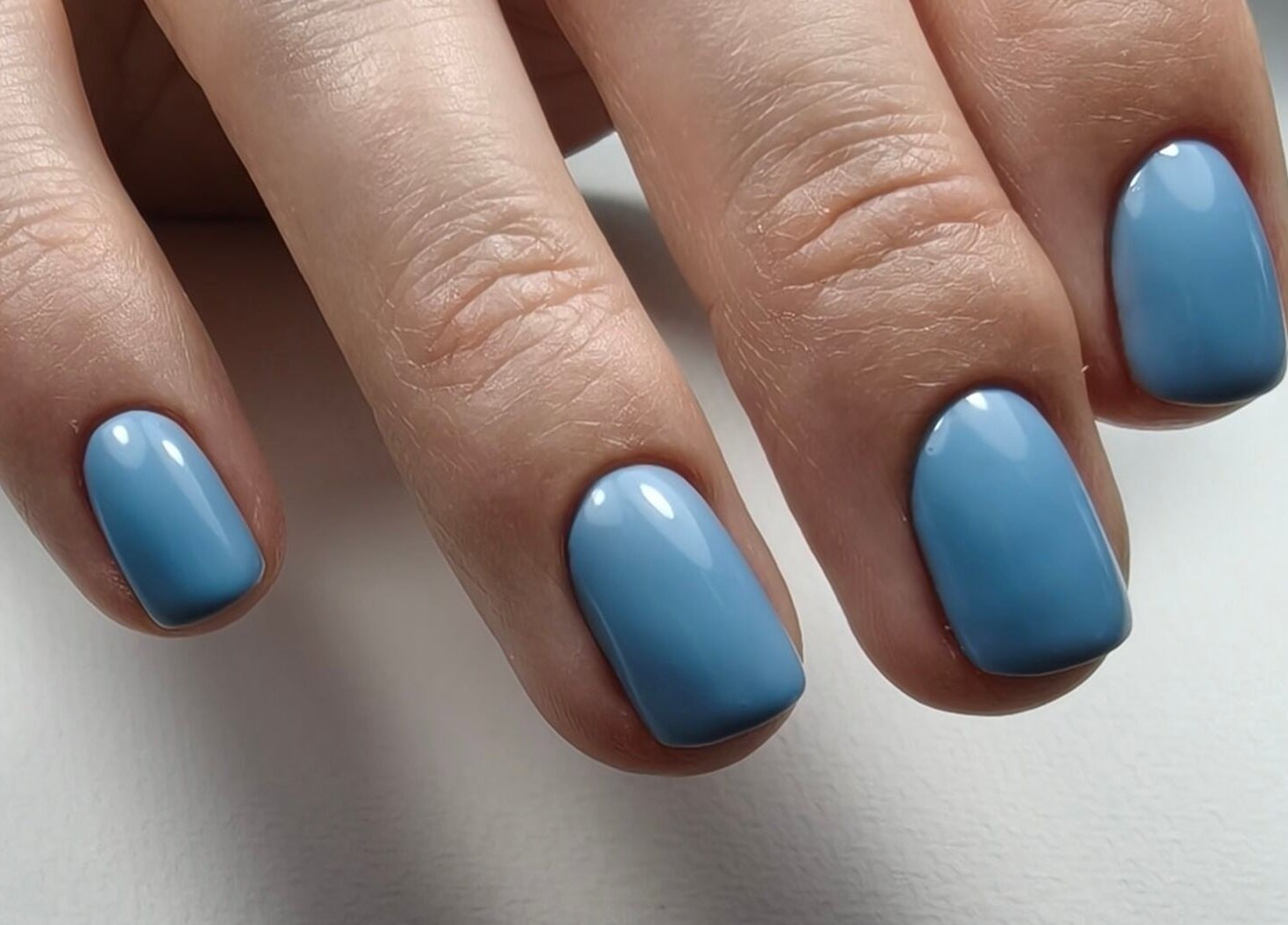 Azure blue nails at Goddess Nail Studio in Auckland, NZ, showcasing professional manicure perfection.