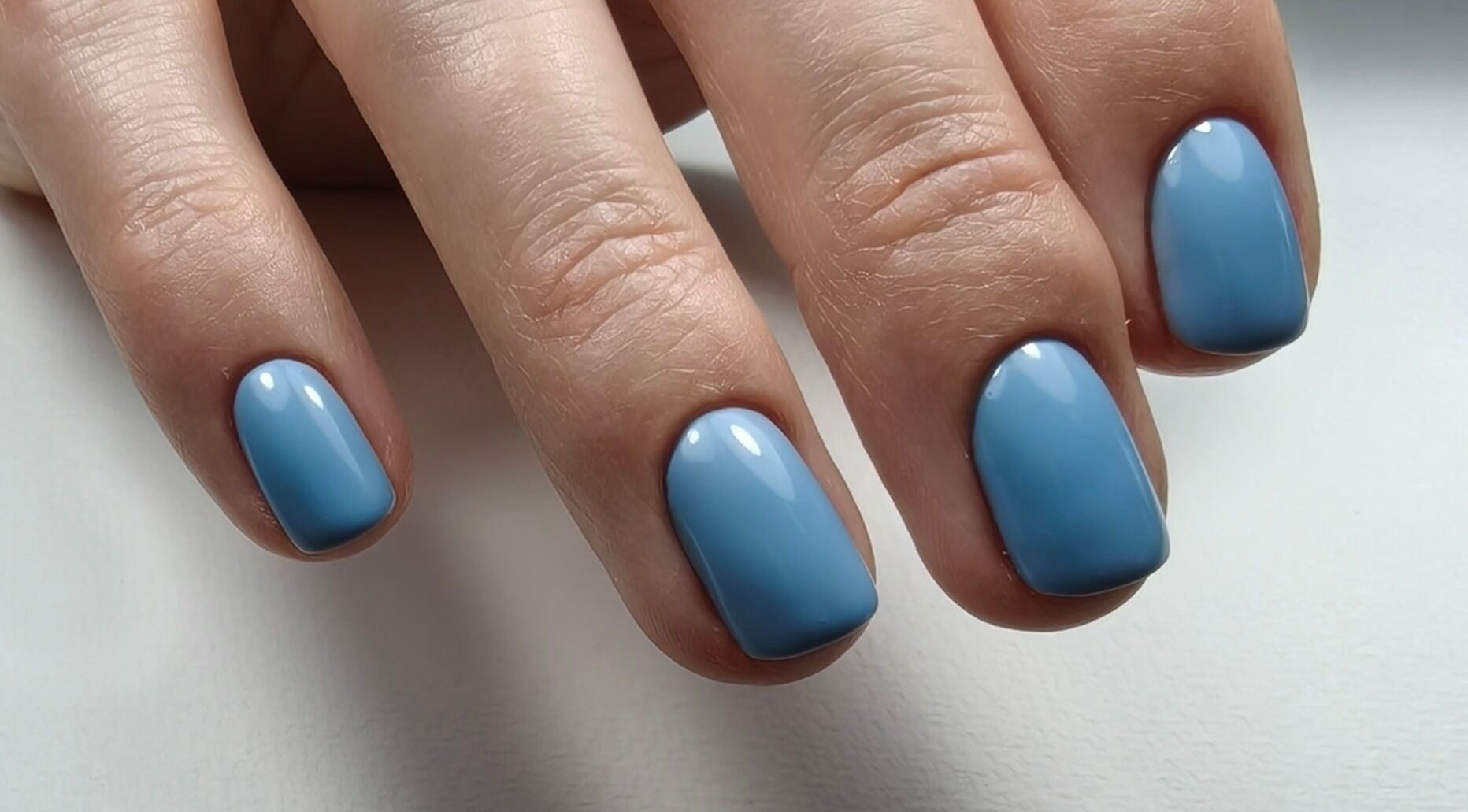 Azure blue nails at Goddess Nail Studio in Auckland, NZ, showcasing professional manicure perfection.