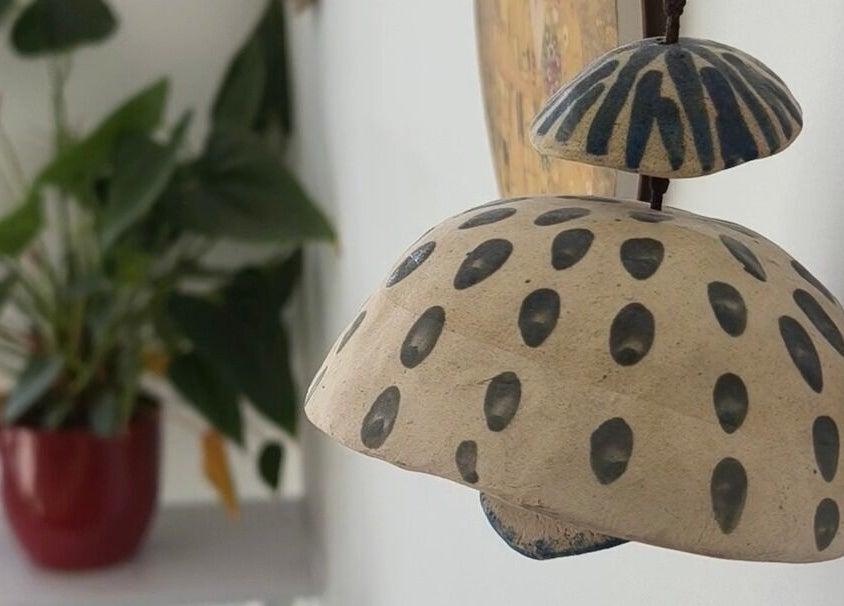 Unique spotted art piece at Goddess Nail Studio, Auckland, Auckland, NZ with lush greenery in the background.