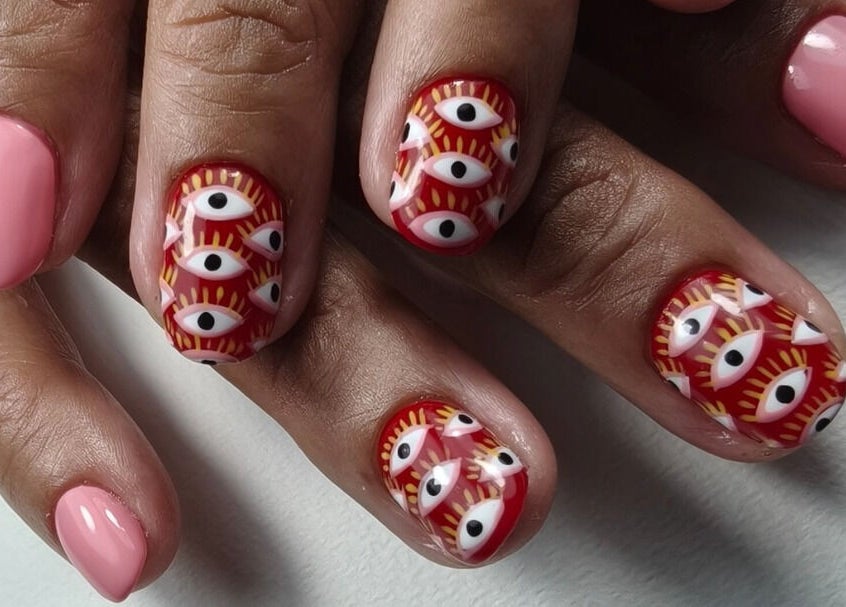 Unique nail art design with eye patterns at Goddess Nail Studio, Auckland, NZ.