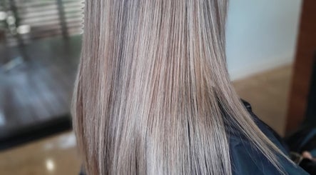 Sleek, silky blonde hair styled at Lelani Hair in Broome, Western Australia, AU, showcasing smooth texture.