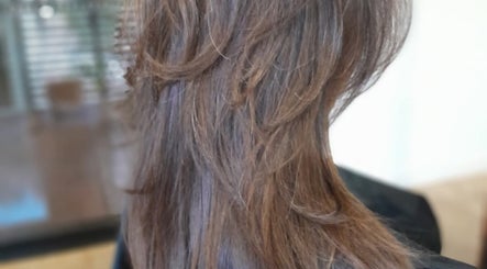 Elegant layered hairstyle at Lelani Hair in Broome, Western Australia, AU, showcasing a chic brown cut.